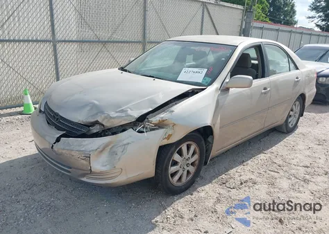 2002 Toyota Camry Xle z USA, uszkodzony, nr VIN 4T1BE32K12U062959